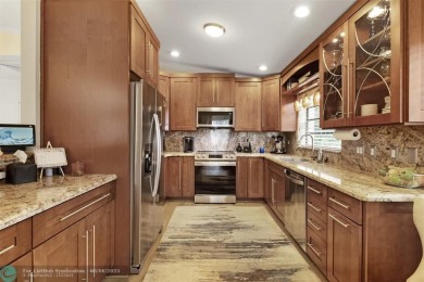 Step into effortless living in the light and bright beautifully on Deer Creek Golf Club in Florida - for sale on GolfHomes.com, golf home, golf lot