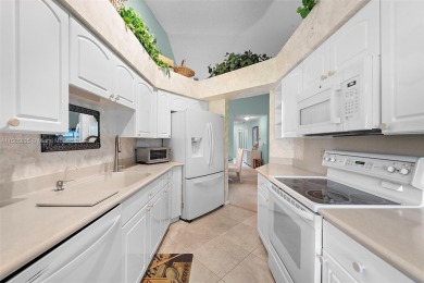 Discover the convenience and beauty of this 3-bedroom, 2-bath on Bocaire Country Club in Florida - for sale on GolfHomes.com, golf home, golf lot