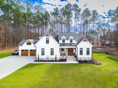 Welcome to this stunning and charming farmhouse-style, perfectly on River Golf and County Club at Lake Royale in North Carolina - for sale on GolfHomes.com, golf home, golf lot