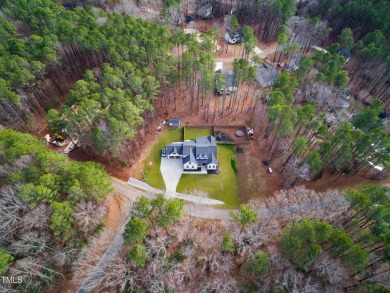 Welcome to this stunning and charming farmhouse-style, perfectly on River Golf and County Club at Lake Royale in North Carolina - for sale on GolfHomes.com, golf home, golf lot