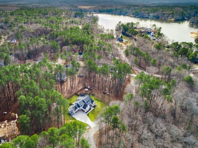 Welcome to this stunning and charming farmhouse-style, perfectly on River Golf and County Club at Lake Royale in North Carolina - for sale on GolfHomes.com, golf home, golf lot