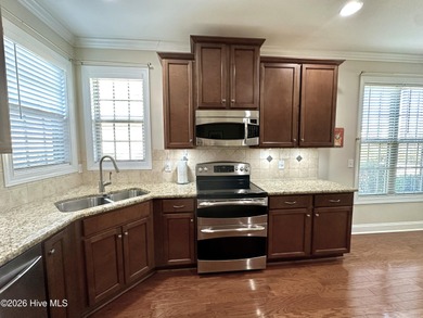 This all-brick, well-maintained, ranch home is located just on Magnolia Greens Golf Plantation in North Carolina - for sale on GolfHomes.com, golf home, golf lot