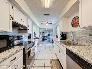 GROUND FLOOR CONDO located on the 8th Fairway of the Heather on Heather Golf and Country Club in Florida - for sale on GolfHomes.com, golf home, golf lot