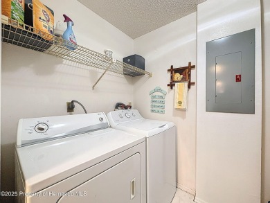 GROUND FLOOR CONDO located on the 8th Fairway of the Heather on Heather Golf and Country Club in Florida - for sale on GolfHomes.com, golf home, golf lot