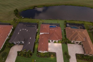 Welcome to 5569 Mulligan Way, an extraordinary two-story on Lakewood National Golf Club in Florida - for sale on GolfHomes.com, golf home, golf lot