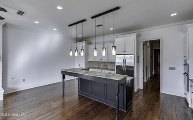 Beautifully appointed home located in the highly sought-after on Reunion Golf Club in Mississippi - for sale on GolfHomes.com, golf home, golf lot