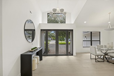 Discover refined luxury in this fully renovated 4,458 sq. ft on PGA National Golf Club in Florida - for sale on GolfHomes.com, golf home, golf lot