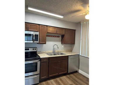 **SPACIOUS AND BRIGHT 3/2 - COMPLETELY RENOVATED FIRST FLOOR on Inverrary Country Club in Florida - for sale on GolfHomes.com, golf home, golf lot