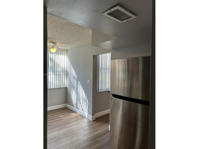 **SPACIOUS AND BRIGHT 3/2 - COMPLETELY RENOVATED FIRST FLOOR on Inverrary Country Club in Florida - for sale on GolfHomes.com, golf home, golf lot