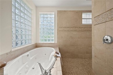Come experience ultimate privacy in this stunning 1st floor on Tiburon Golf Club in Florida - for sale on GolfHomes.com, golf home, golf lot