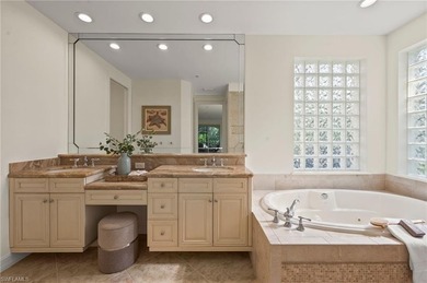 Come experience ultimate privacy in this stunning 1st floor on Tiburon Golf Club in Florida - for sale on GolfHomes.com, golf home, golf lot