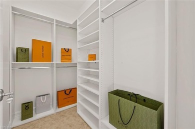 Come experience ultimate privacy in this stunning 1st floor on Tiburon Golf Club in Florida - for sale on GolfHomes.com, golf home, golf lot