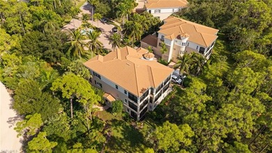Come experience ultimate privacy in this stunning 1st floor on Tiburon Golf Club in Florida - for sale on GolfHomes.com, golf home, golf lot