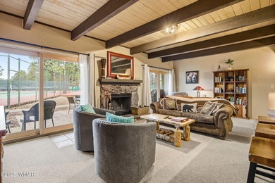 Step onto the spacious deck and take in breathtaking views of on Pinetop Lakes Golf and Country Club in Arizona - for sale on GolfHomes.com, golf home, golf lot