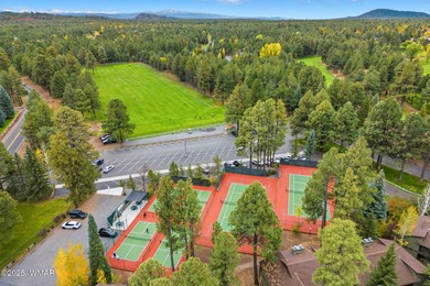 Step onto the spacious deck and take in breathtaking views of on Pinetop Lakes Golf and Country Club in Arizona - for sale on GolfHomes.com, golf home, golf lot