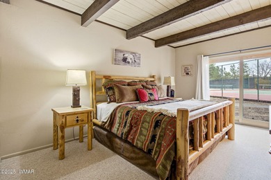 Step onto the spacious deck and take in breathtaking views of on Pinetop Lakes Golf and Country Club in Arizona - for sale on GolfHomes.com, golf home, golf lot