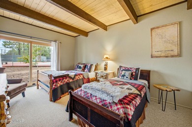 Step onto the spacious deck and take in breathtaking views of on Pinetop Lakes Golf and Country Club in Arizona - for sale on GolfHomes.com, golf home, golf lot