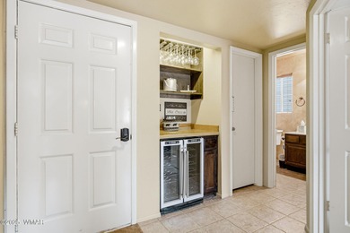 Step onto the spacious deck and take in breathtaking views of on Pinetop Lakes Golf and Country Club in Arizona - for sale on GolfHomes.com, golf home, golf lot