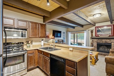 Step onto the spacious deck and take in breathtaking views of on Pinetop Lakes Golf and Country Club in Arizona - for sale on GolfHomes.com, golf home, golf lot