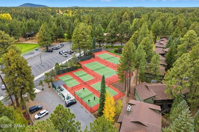 Step onto the spacious deck and take in breathtaking views of on Pinetop Lakes Golf and Country Club in Arizona - for sale on GolfHomes.com, golf home, golf lot