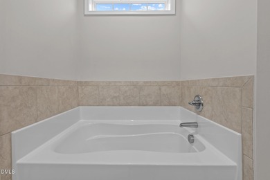 Welcome to this beautiful 4-bedroom, 3-bath home located in The on The Carolina Club in North Carolina - for sale on GolfHomes.com, golf home, golf lot