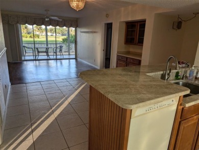 Golf course living at its finest! This charming first-floor on Deep Creek Golf Club in Florida - for sale on GolfHomes.com, golf home, golf lot