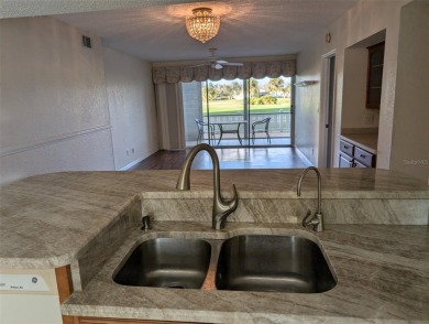 Golf course living at its finest! This charming first-floor on Deep Creek Golf Club in Florida - for sale on GolfHomes.com, golf home, golf lot