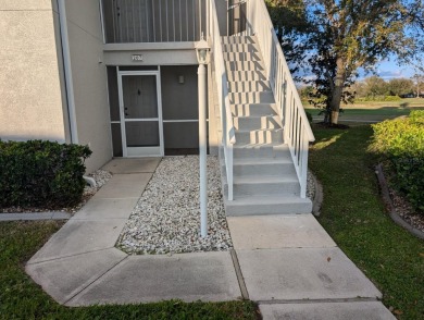 Golf course living at its finest! This charming first-floor on Deep Creek Golf Club in Florida - for sale on GolfHomes.com, golf home, golf lot