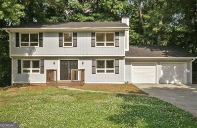 This charming 4-bedroom 3-bath home is perfect for a growing on Hidden Hills Country Club in Georgia - for sale on GolfHomes.com, golf home, golf lot