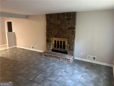 This charming 4-bedroom 3-bath home is perfect for a growing on Hidden Hills Country Club in Georgia - for sale on GolfHomes.com, golf home, golf lot