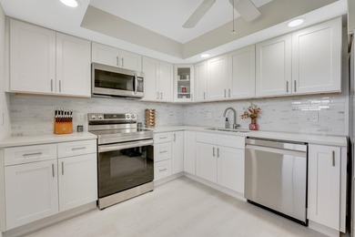 Experience elevated living in this stunning top-floor sanctuary on Palm-Aire Country Club and Resort - The Oaks in Florida - for sale on GolfHomes.com, golf home, golf lot