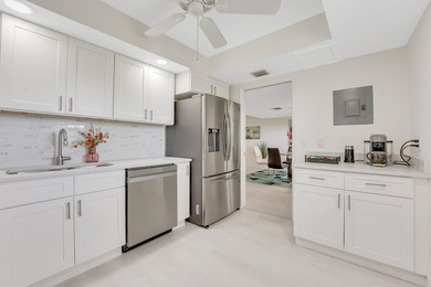 Experience elevated living in this stunning top-floor sanctuary on Palm-Aire Country Club and Resort - The Oaks in Florida - for sale on GolfHomes.com, golf home, golf lot