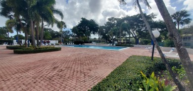 Beautifully renovated 2 bedroom 2 bath condo overlooking on Palm-Aire Country Club and Resort - Palms in Florida - for sale on GolfHomes.com, golf home, golf lot