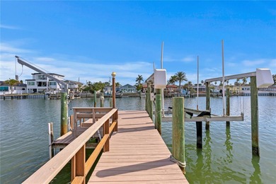 The ultimate Live-Work-Play lifestyle awaits in this beautifully on Isla Del Sol Yacht and Country Club in Florida - for sale on GolfHomes.com, golf home, golf lot