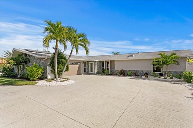 The ultimate Live-Work-Play lifestyle awaits in this beautifully on Isla Del Sol Yacht and Country Club in Florida - for sale on GolfHomes.com, golf home, golf lot