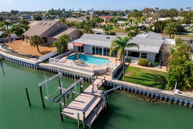 The ultimate Live-Work-Play lifestyle awaits in this beautifully on Isla Del Sol Yacht and Country Club in Florida - for sale on GolfHomes.com, golf home, golf lot