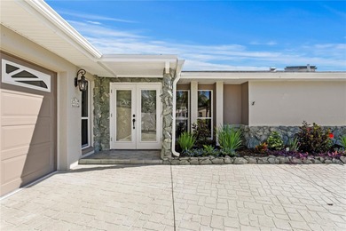 The ultimate Live-Work-Play lifestyle awaits in this beautifully on Isla Del Sol Yacht and Country Club in Florida - for sale on GolfHomes.com, golf home, golf lot