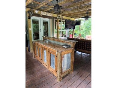 This private and peaceful lakefront home is located in the piney on Pine Dunes Golf Course in Texas - for sale on GolfHomes.com, golf home, golf lot