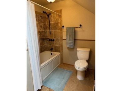This private and peaceful lakefront home is located in the piney on Pine Dunes Golf Course in Texas - for sale on GolfHomes.com, golf home, golf lot