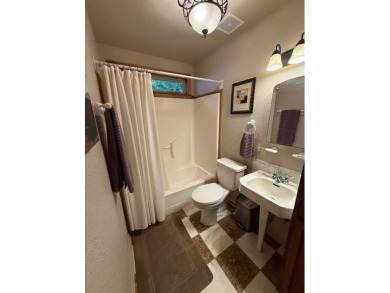 This private and peaceful lakefront home is located in the piney on Pine Dunes Golf Course in Texas - for sale on GolfHomes.com, golf home, golf lot