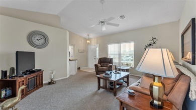 Well-maintained home featuring carpet flooring and a comfortable on Sandpiper Golf Club in Florida - for sale on GolfHomes.com, golf home, golf lot