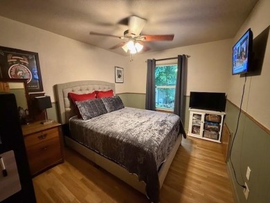 This private and peaceful lakefront home is located in the piney on Pine Dunes Golf Course in Texas - for sale on GolfHomes.com, golf home, golf lot