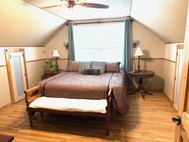 This private and peaceful lakefront home is located in the piney on Pine Dunes Golf Course in Texas - for sale on GolfHomes.com, golf home, golf lot