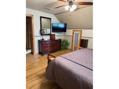 This private and peaceful lakefront home is located in the piney on Pine Dunes Golf Course in Texas - for sale on GolfHomes.com, golf home, golf lot