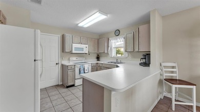 Well-maintained home featuring carpet flooring and a comfortable on Sandpiper Golf Club in Florida - for sale on GolfHomes.com, golf home, golf lot