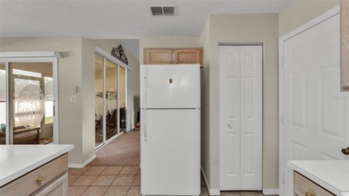 Well-maintained home featuring carpet flooring and a comfortable on Sandpiper Golf Club in Florida - for sale on GolfHomes.com, golf home, golf lot