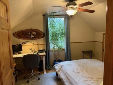 This private and peaceful lakefront home is located in the piney on Pine Dunes Golf Course in Texas - for sale on GolfHomes.com, golf home, golf lot