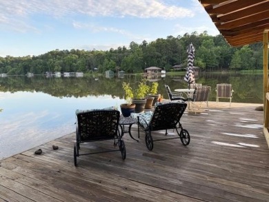 This private and peaceful lakefront home is located in the piney on Pine Dunes Golf Course in Texas - for sale on GolfHomes.com, golf home, golf lot