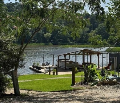 This private and peaceful lakefront home is located in the piney on Pine Dunes Golf Course in Texas - for sale on GolfHomes.com, golf home, golf lot