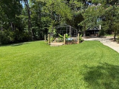 This private and peaceful lakefront home is located in the piney on Pine Dunes Golf Course in Texas - for sale on GolfHomes.com, golf home, golf lot